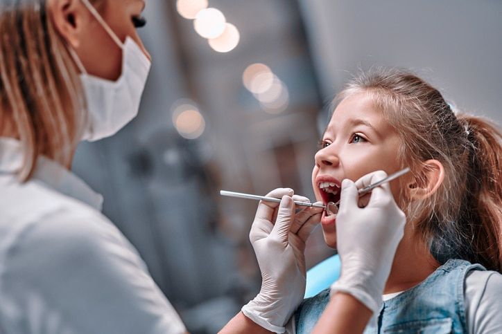 Viewed oral hygiene. Child to the dentist. Child in the dental chair dental treatment during surgery.