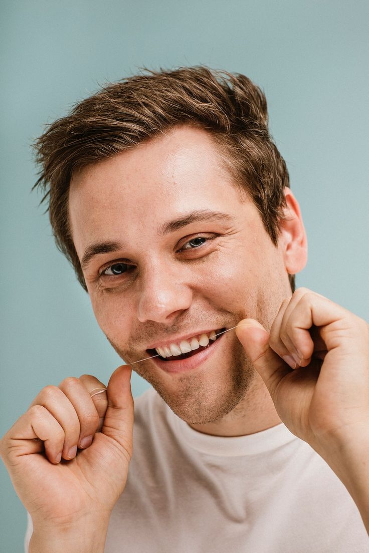 Man using a dental floss